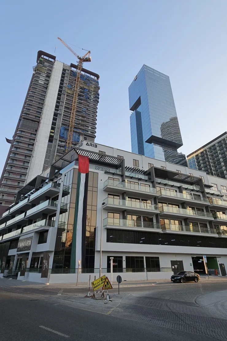 Corner view of the white balconied building
