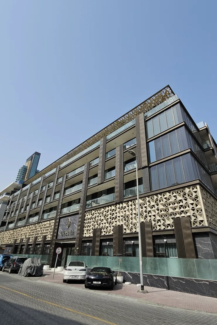 Full facade with Lusail signage and geometric screen