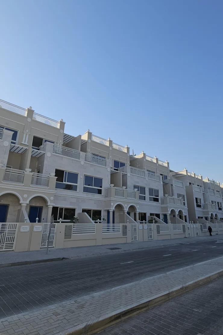 Completed townhouse row facade seen from street