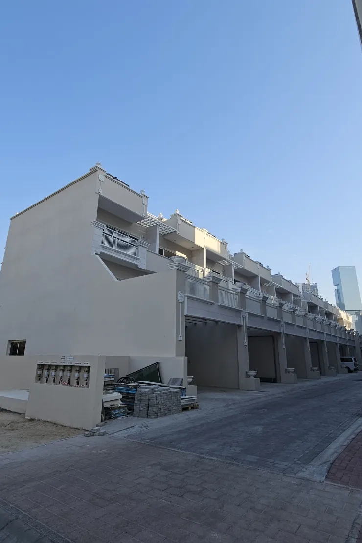 Rear side of townhouse row with garages