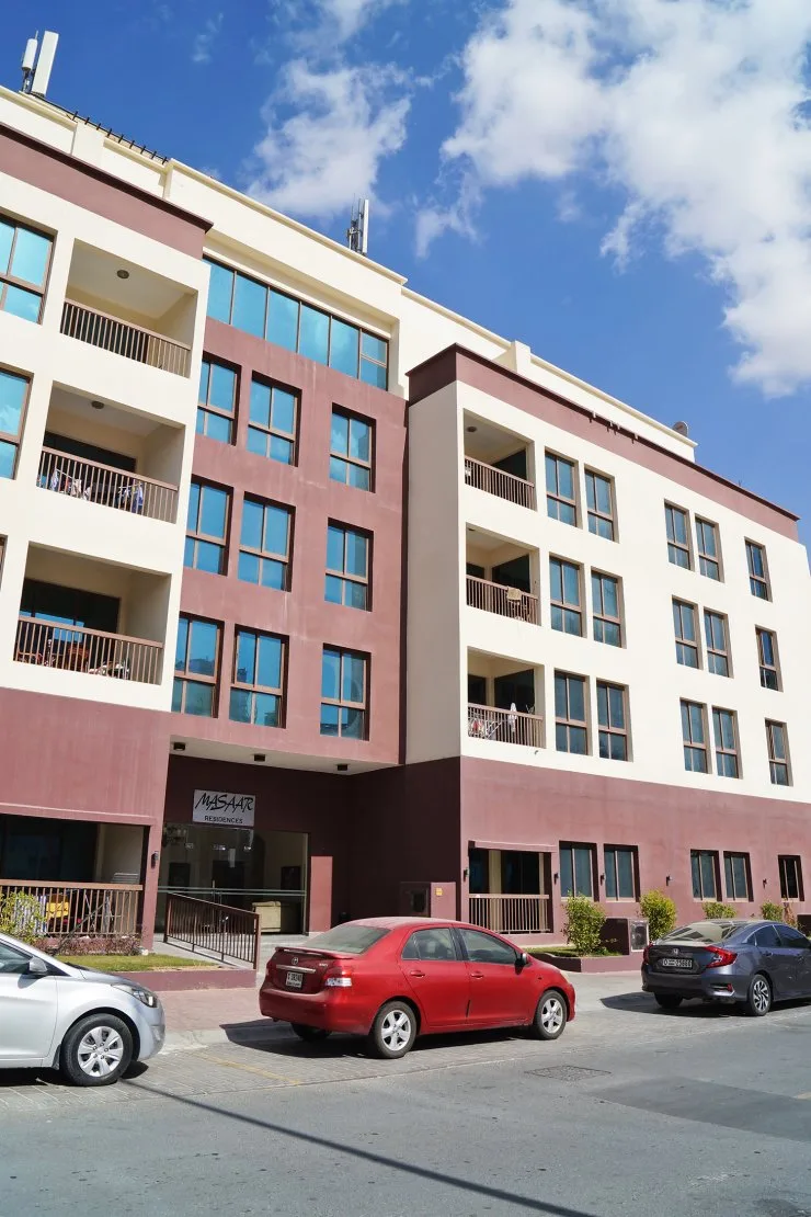 Entrance with Masaar Residences sign, balconies