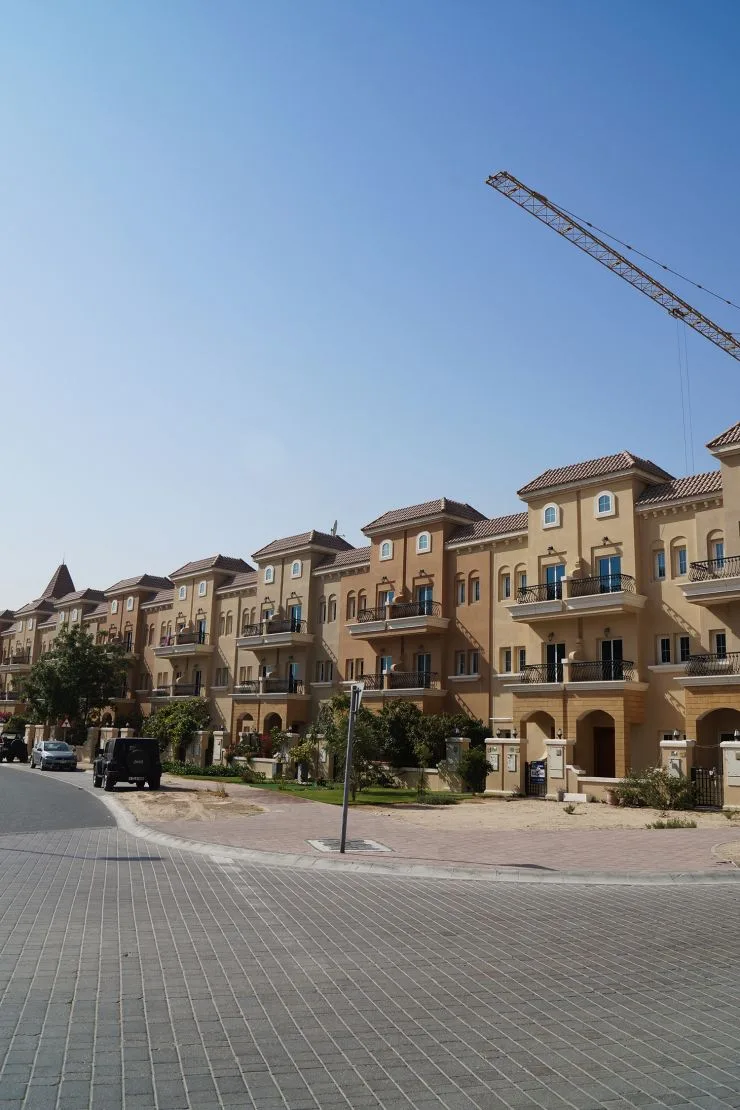 Row of ochre Mediterranean-style townhouses