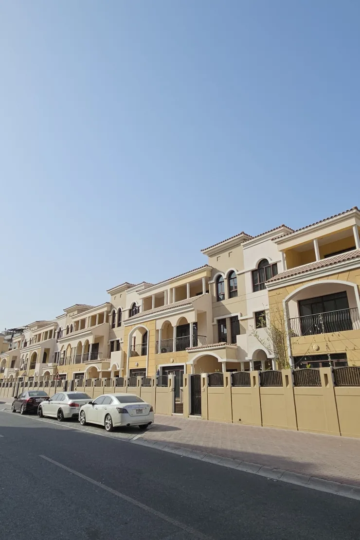 Row of Mediterranean-style townhouses seen from the street
