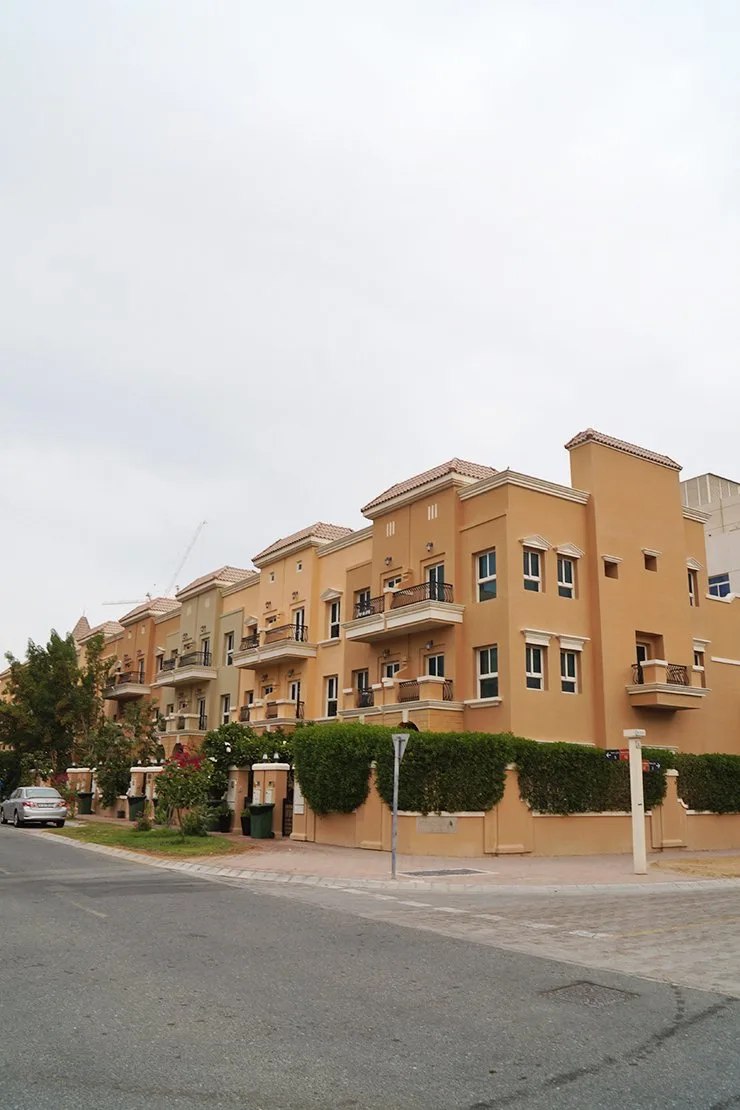 Same block from the corner, hedges and balconies