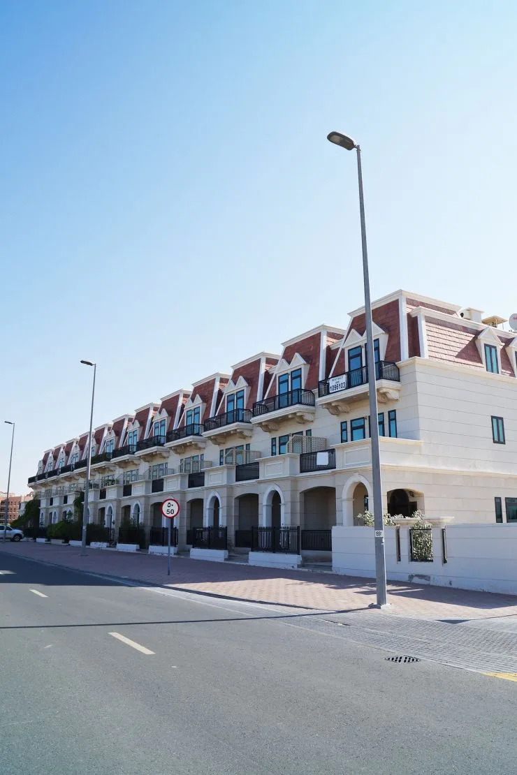 Street view of Mulberry Mansions' mansard-roofed facade