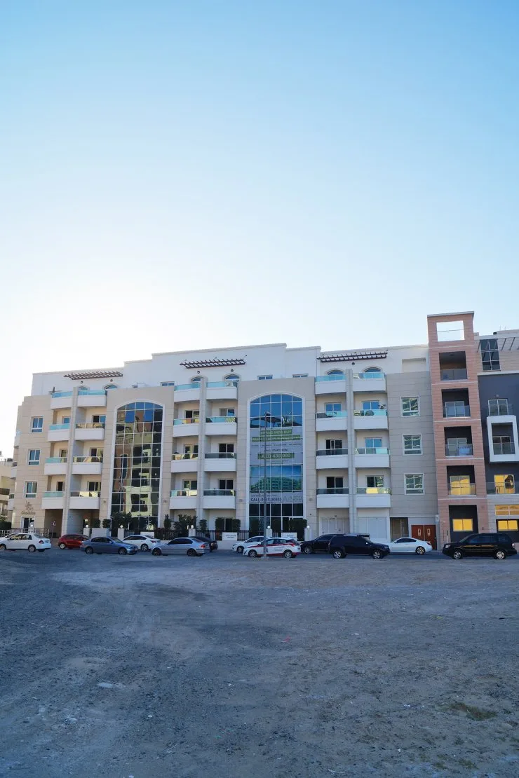 Full facade of the low-rise building from street level