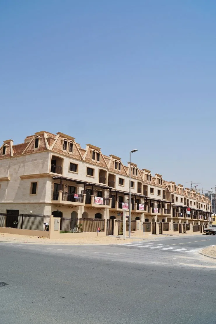 Townhouse block with dormer roofline, street corner