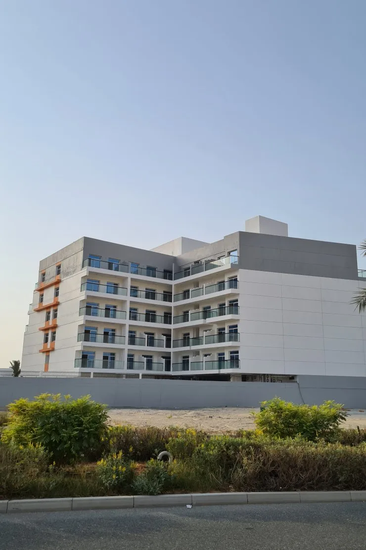 Side facade, white with grey crown and orange accents