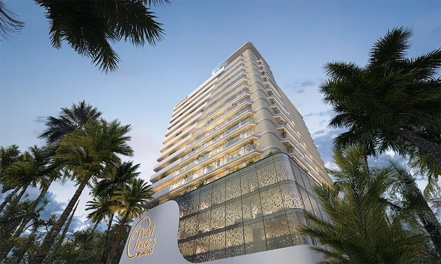 Low-angle view of tower and podium through palms