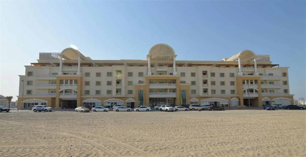 Front facade of five-storey block with arched pergolas