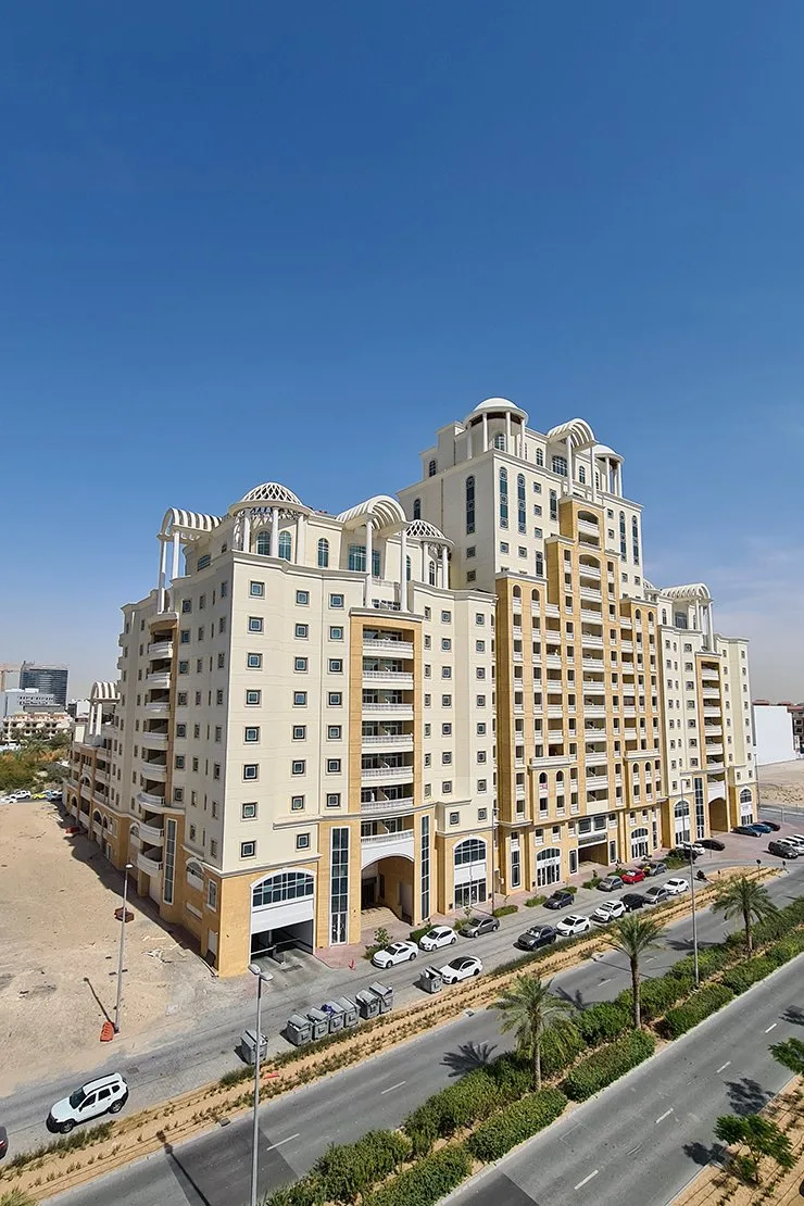 Full Plaza Residences complex from corner, domed crowns