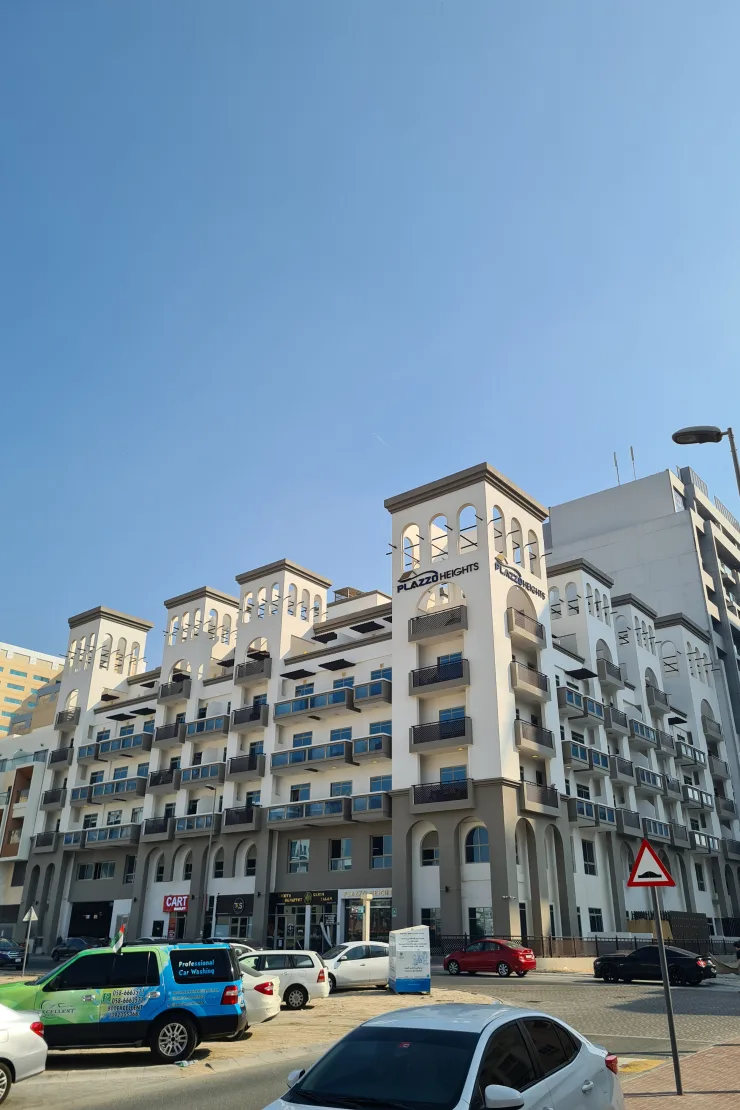 Street view of Plazzo Heights facade and towers