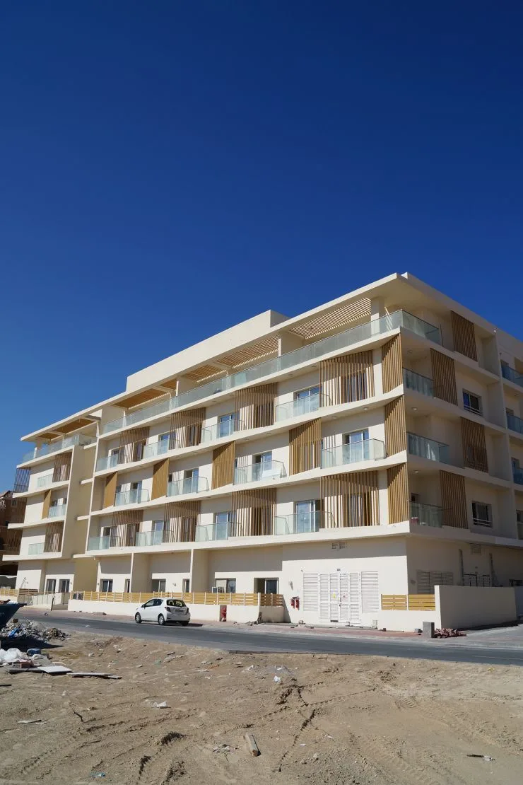Corner view of the completed low-rise building