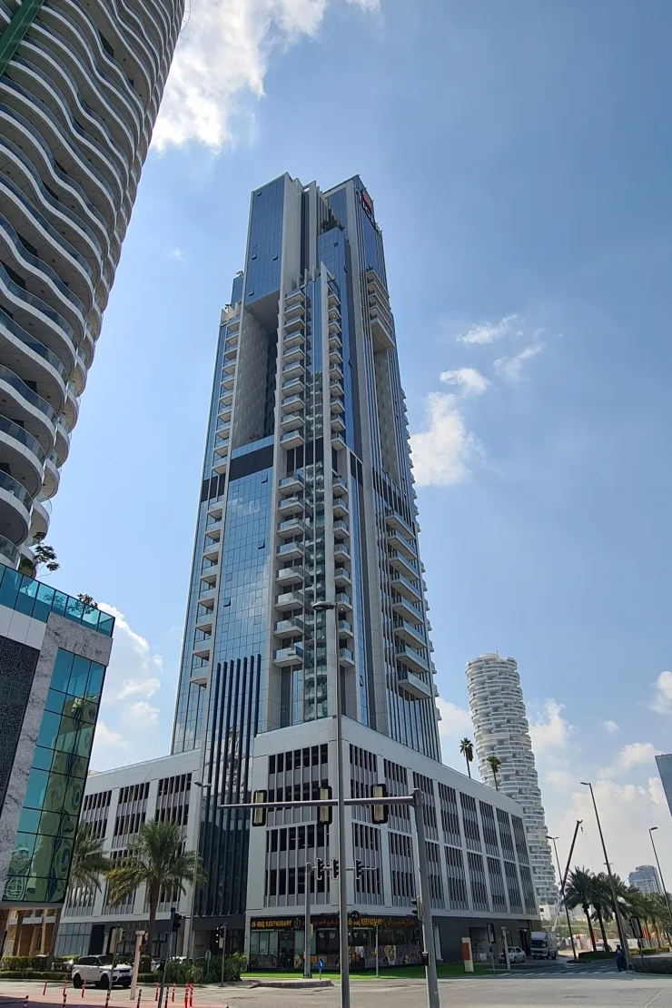Full-height Regina Tower from street, podium to crown