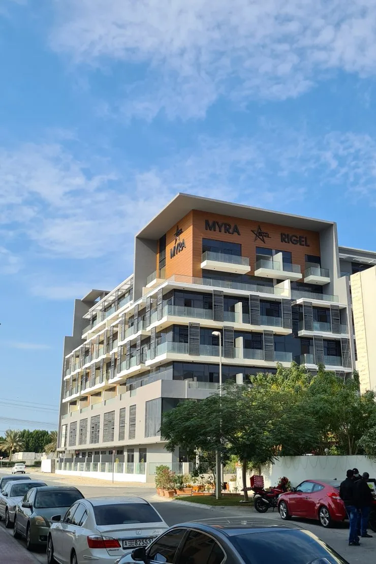 Completed Rigel building with signage, seen from street