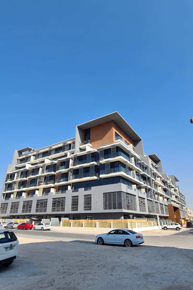 Full building exterior from street corner