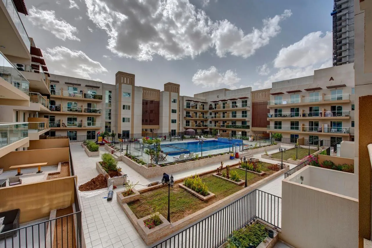 Courtyard pool and gardens surrounded by the blocks