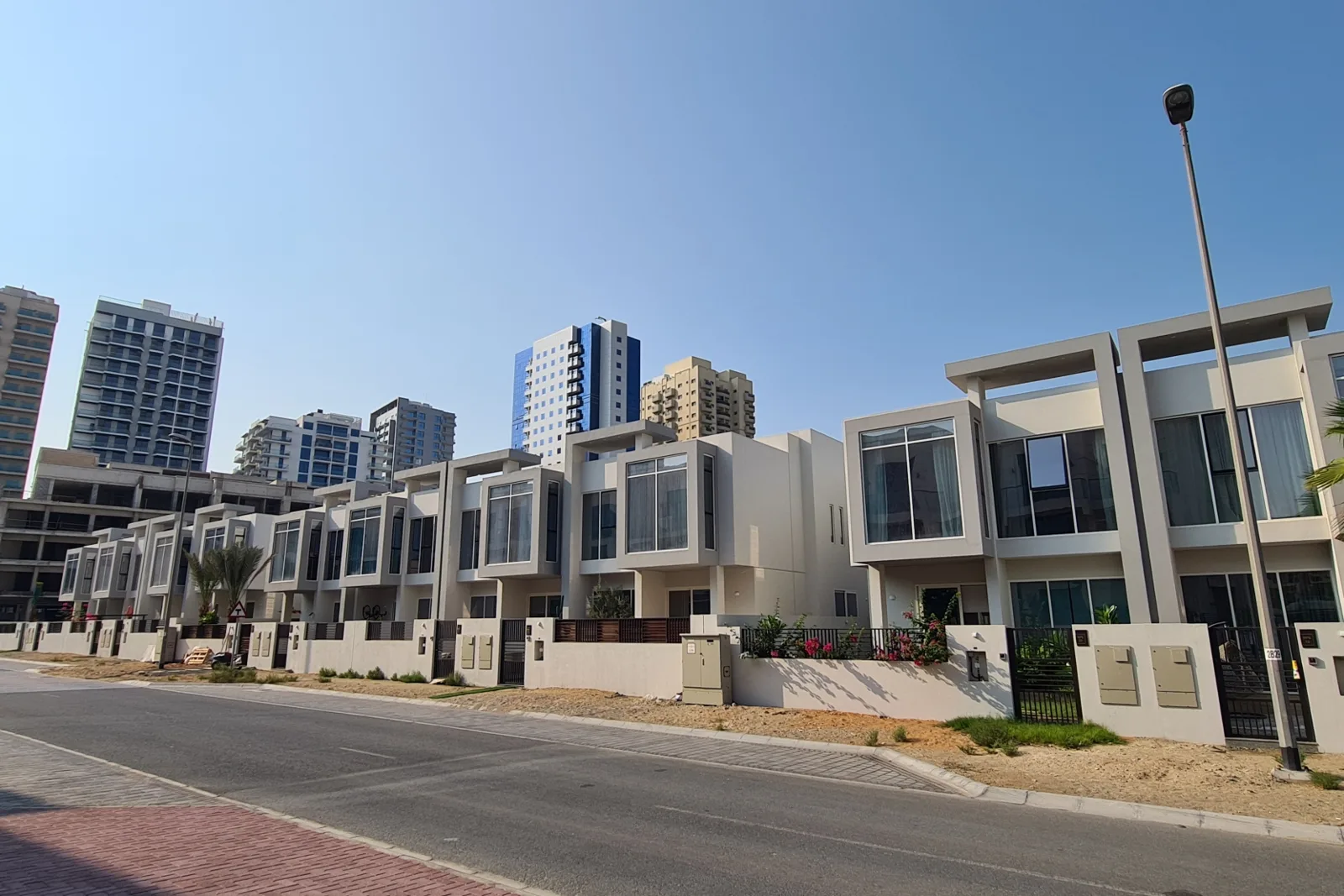 Row of townhouses with boxed glazed bays