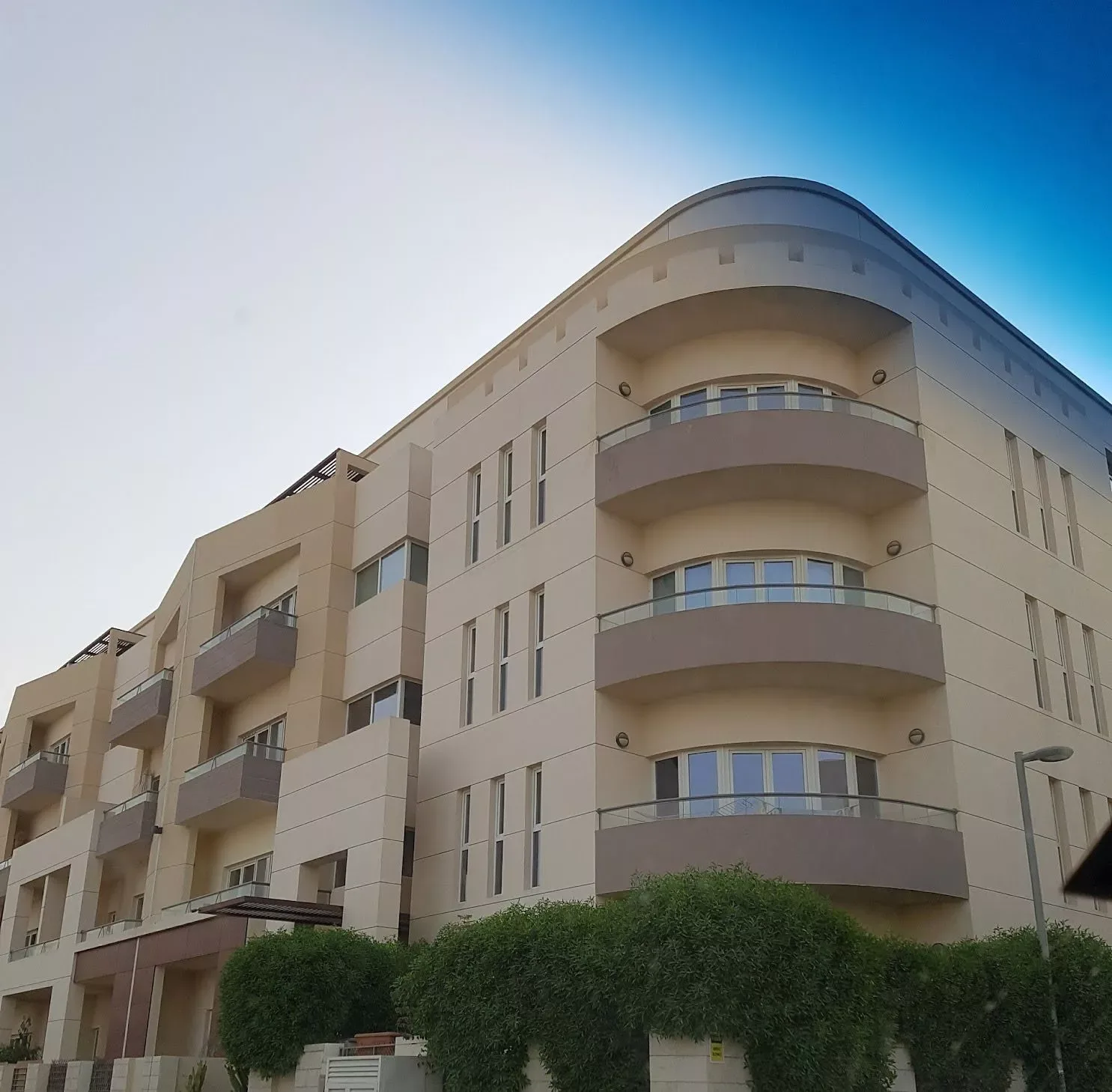 Rounded corner with curved balconies, low angle