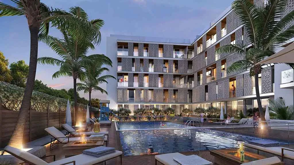 Pool deck with perforated-facade apartment block