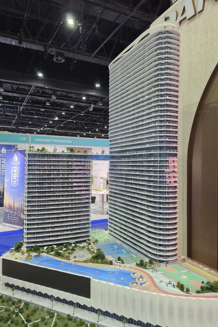 Scale model of towers with pool deck and courts