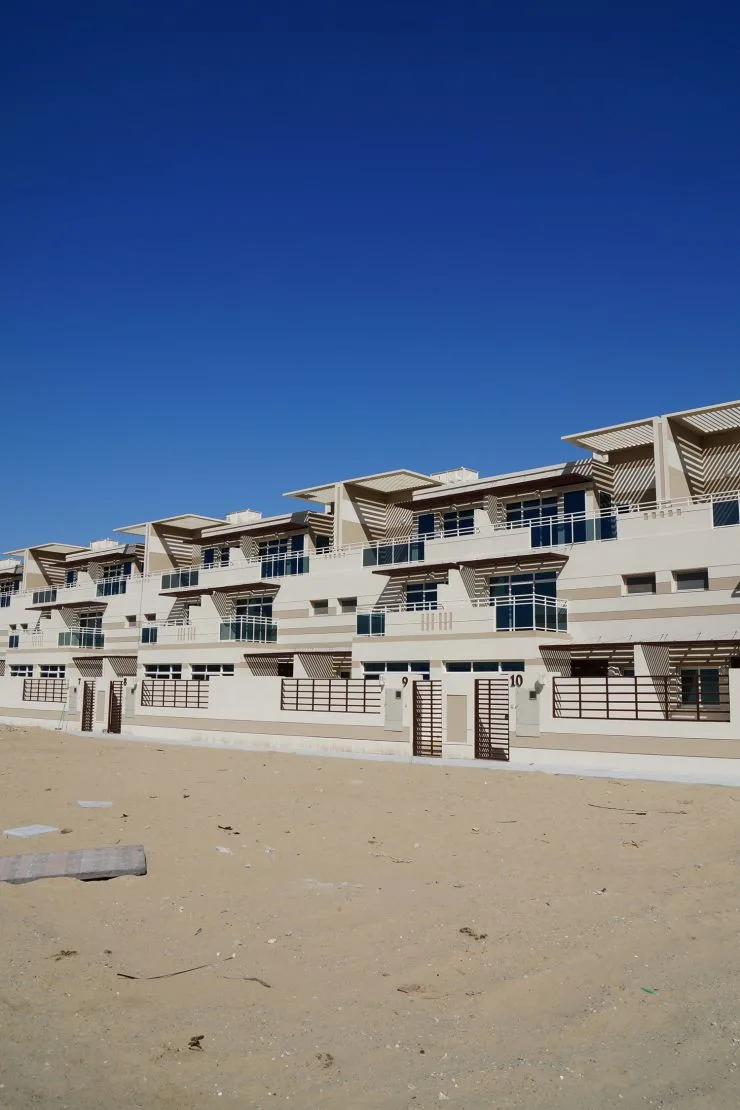 Long terraced row with louvred canopies