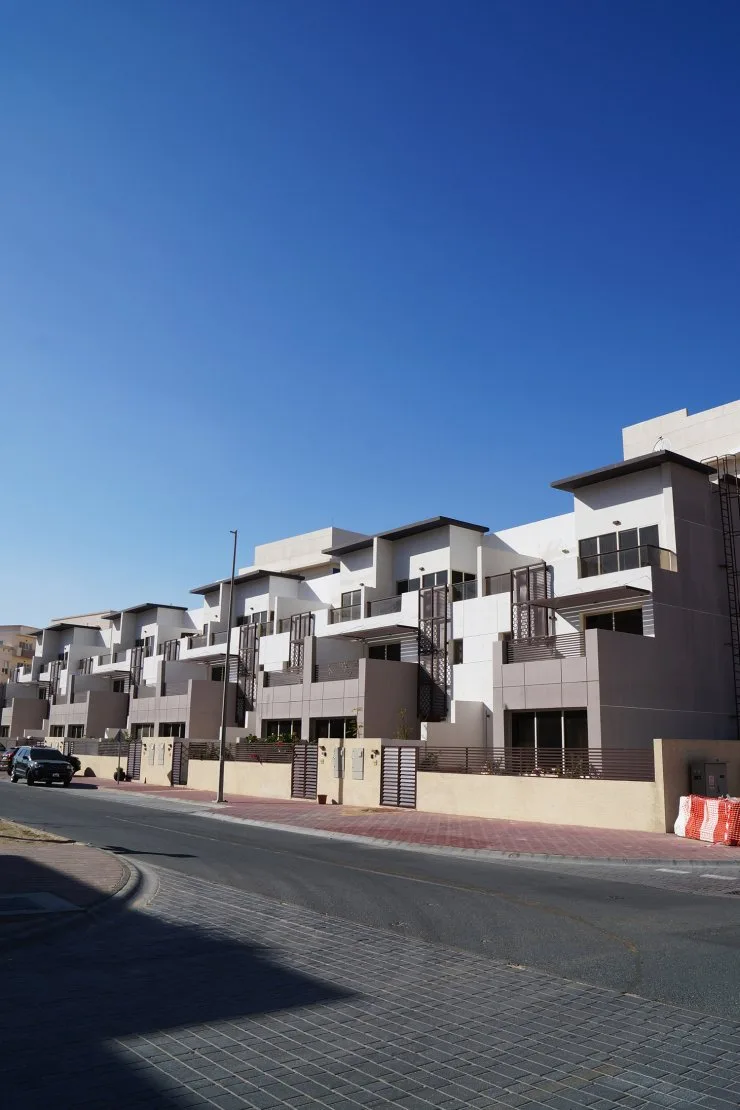 Row of terraced townhouses along street