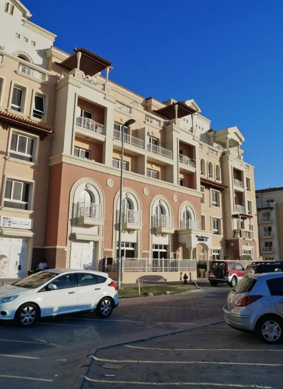 Tuscan-style facade with arched ground-floor entrances