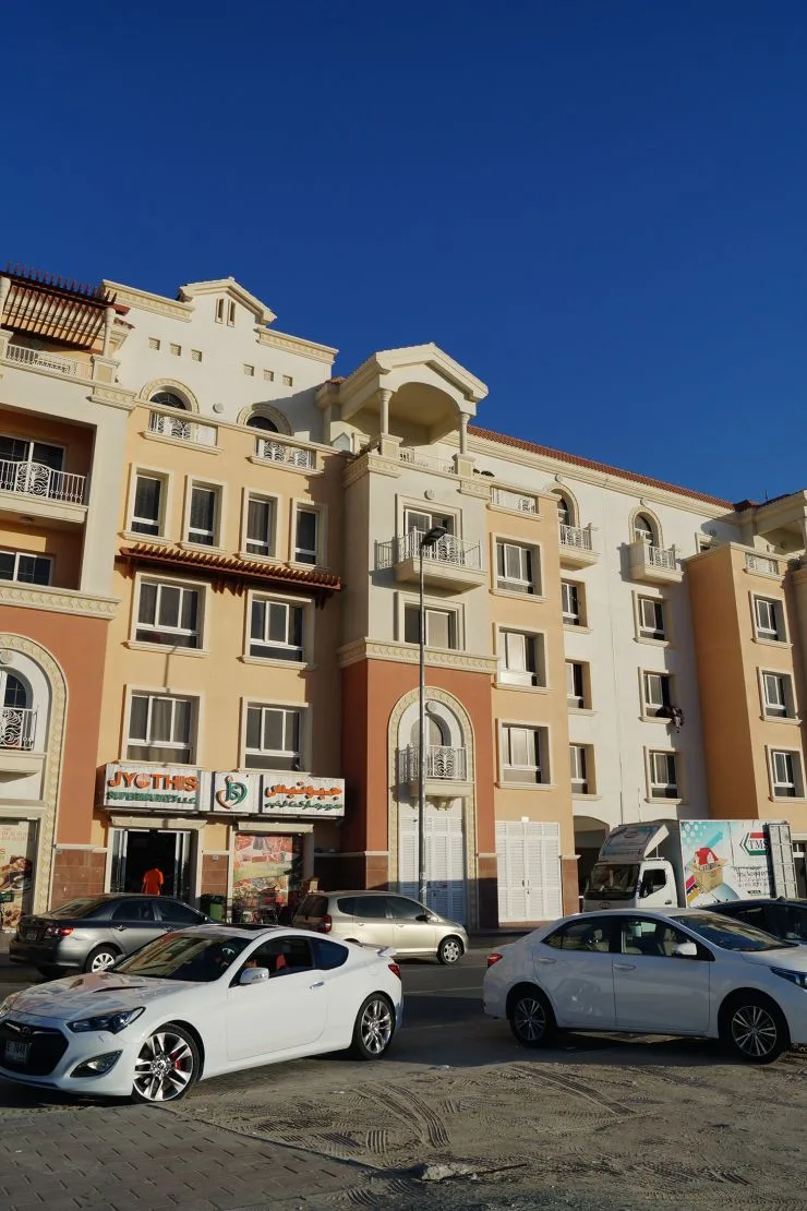 Peach and cream Tuscan facade with balconies
