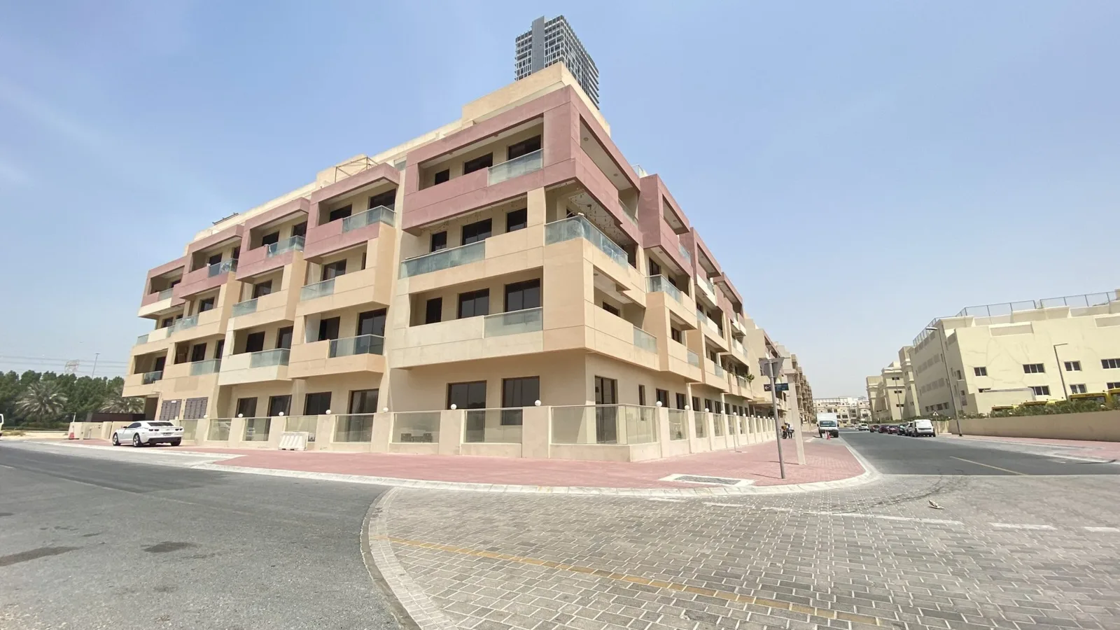 Corner view of full building with pink panels