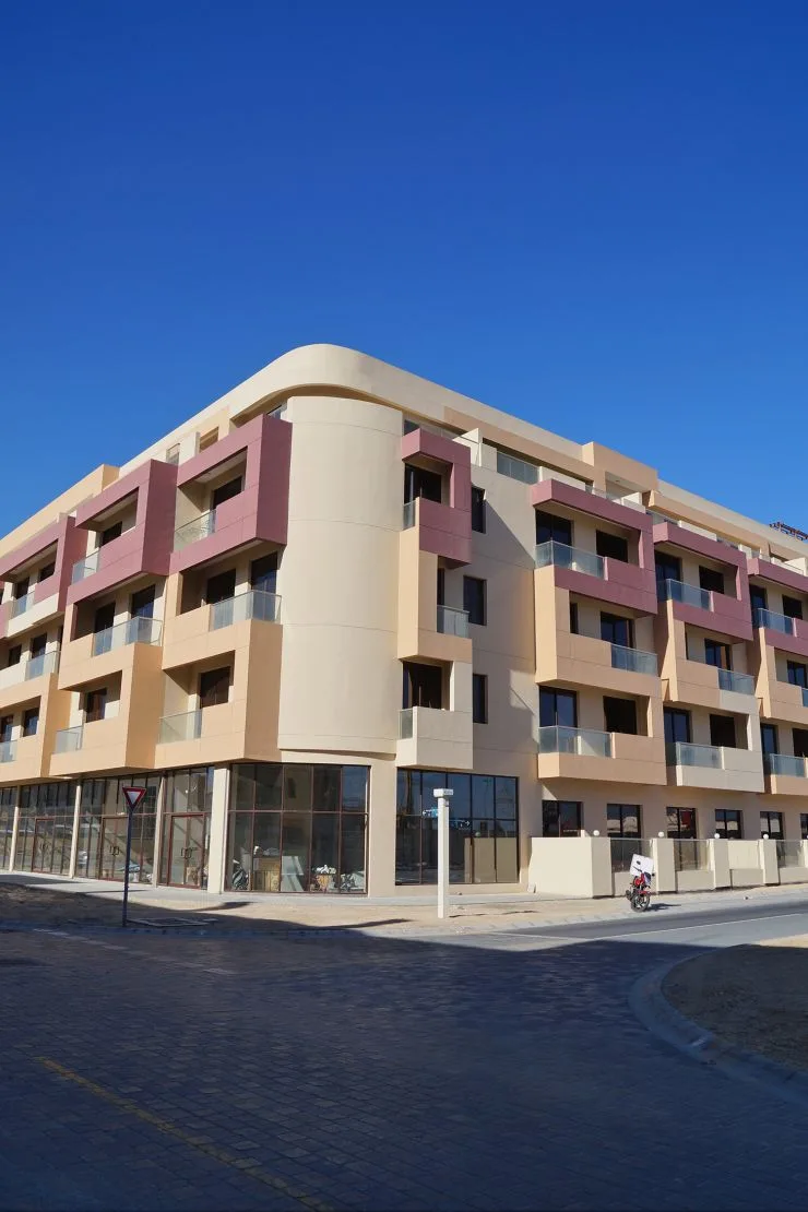 Rounded corner and balconies against blue sky