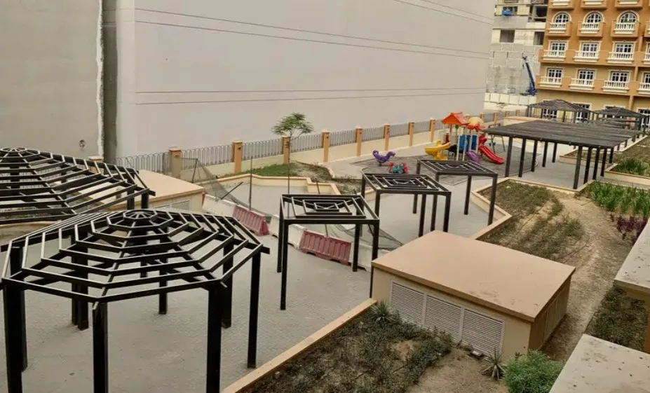 Courtyard with pergolas and children's playground