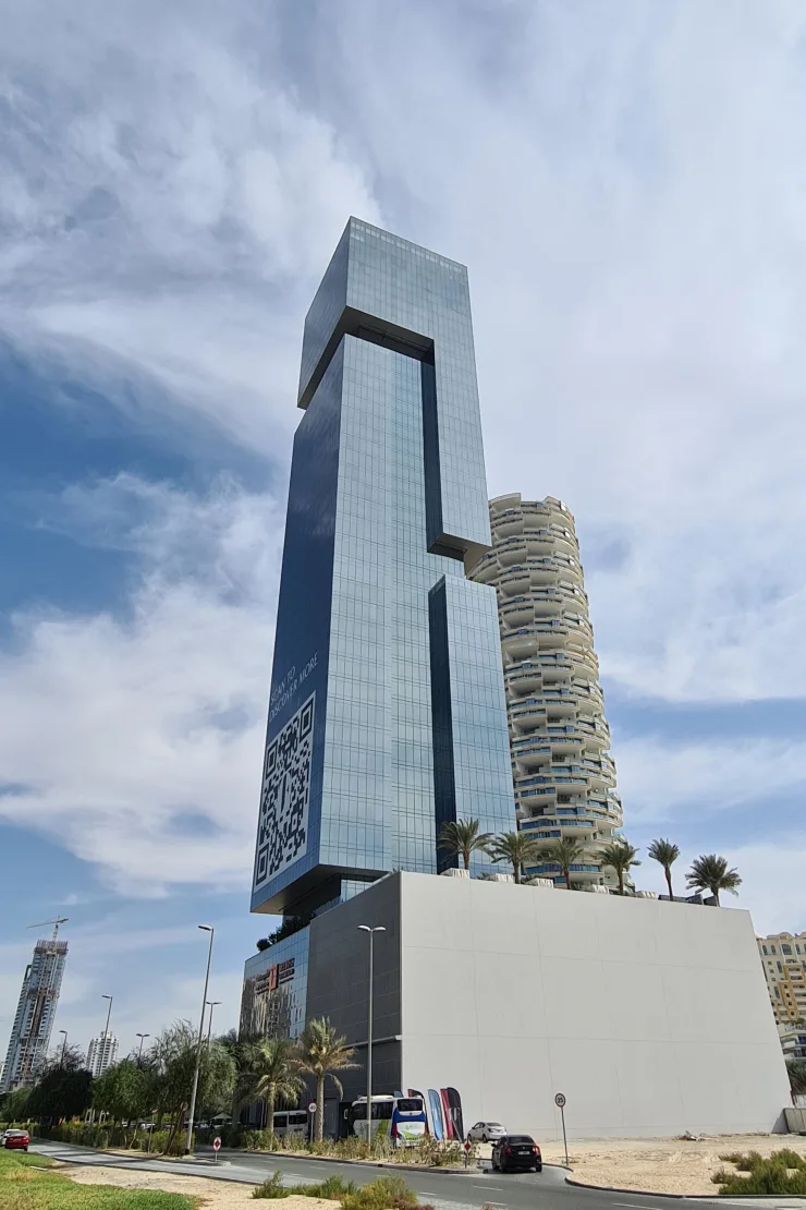 Street-level view of tower and podium