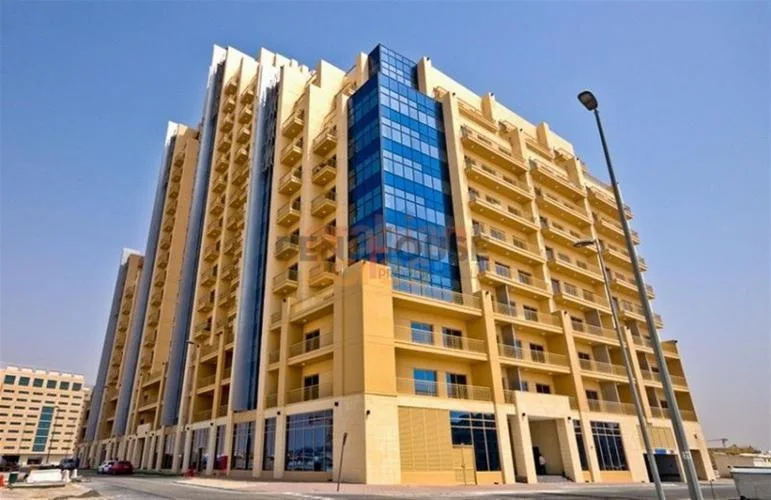 Low angle of tower with blue glass facade