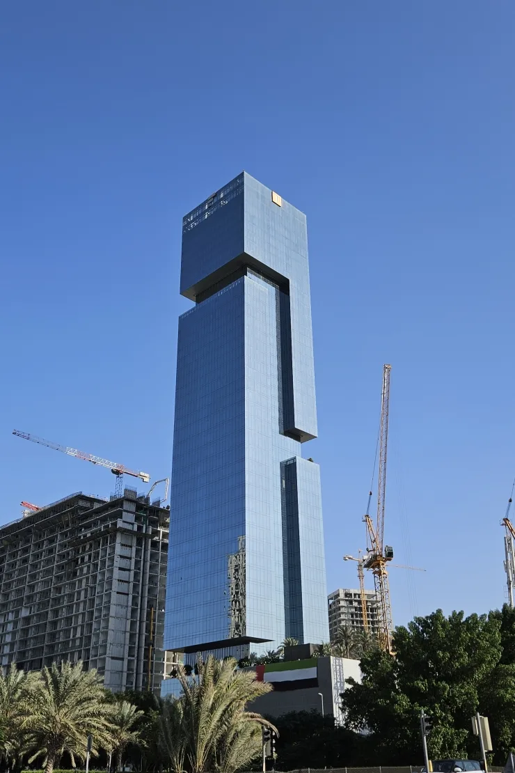 Tower against blue sky, ground-level view