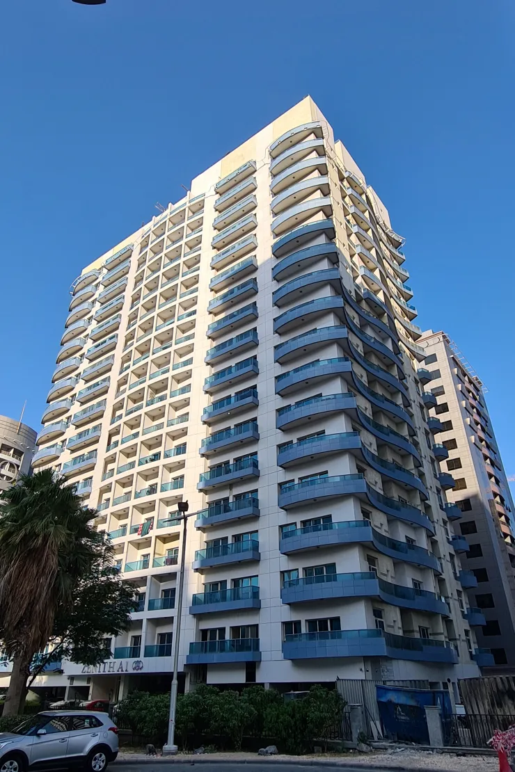 Tower seen from low angle, signage at base