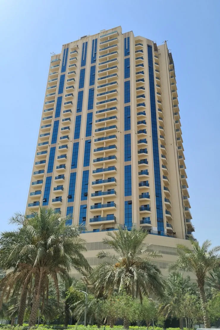 Full tower from ground, cream facade, blue glazing