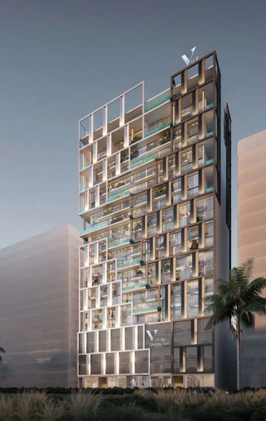 Tower at dusk, white grid facade, glass pools