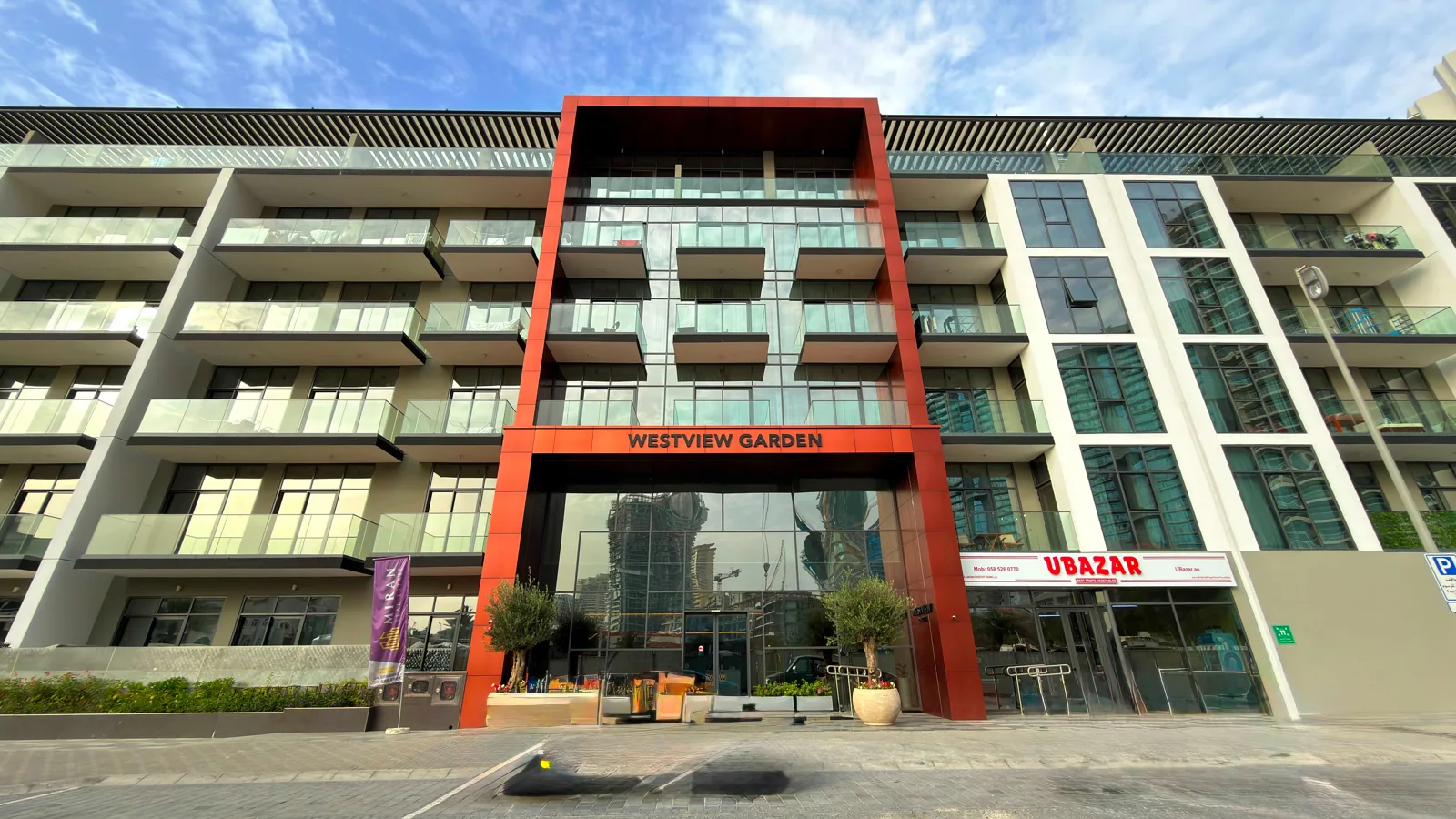 Westview Garden entrance with red frame and signage