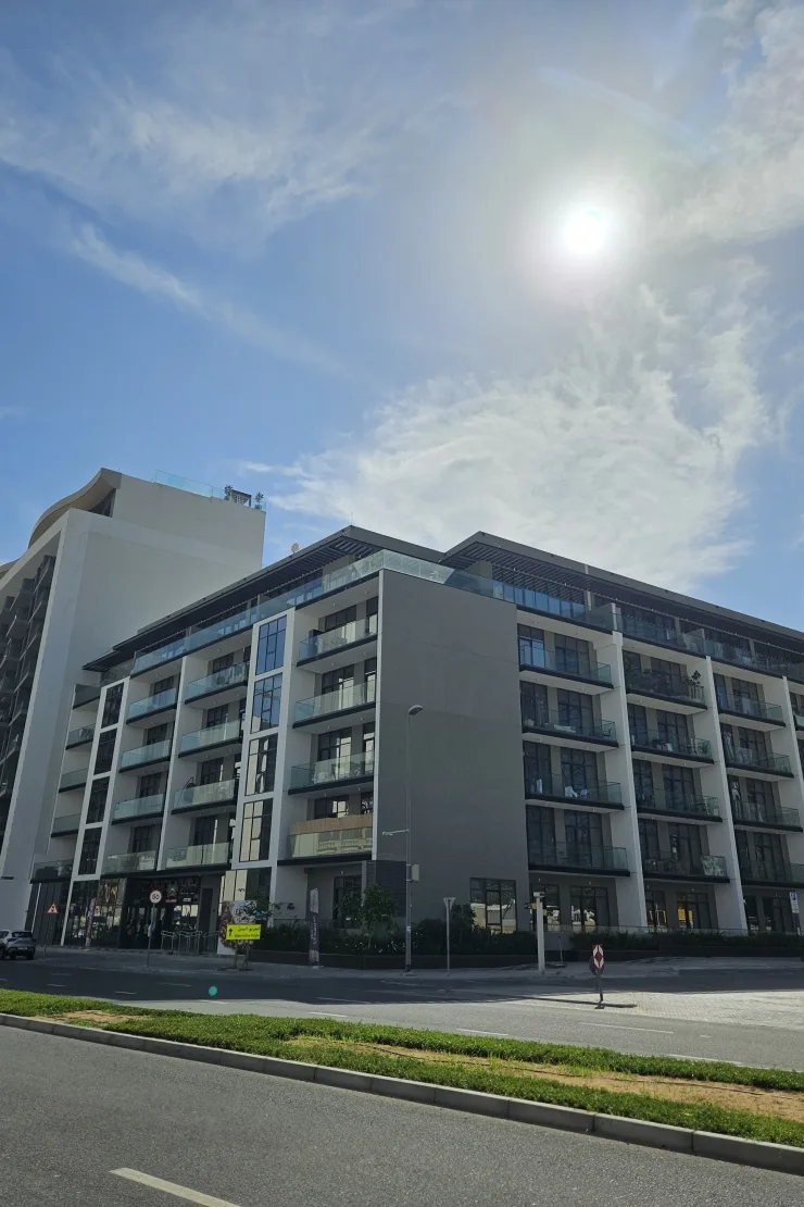 Corner view of mid-rise building with balconies