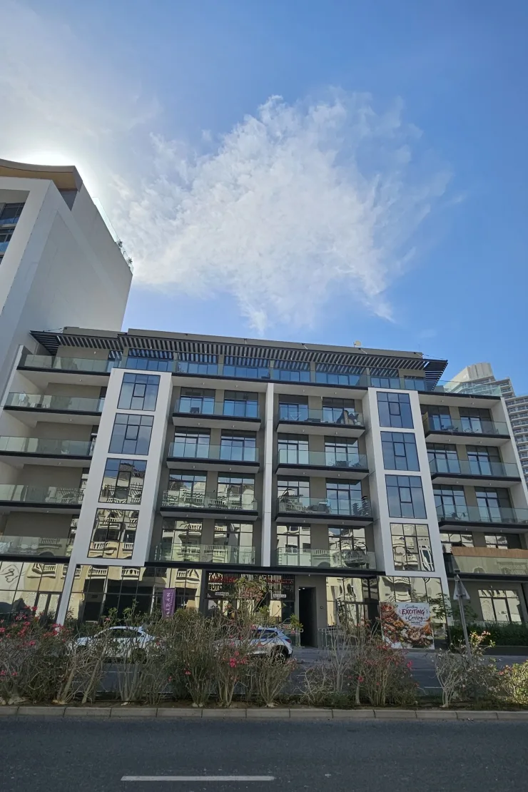 Front facade with balconies and street-level shops