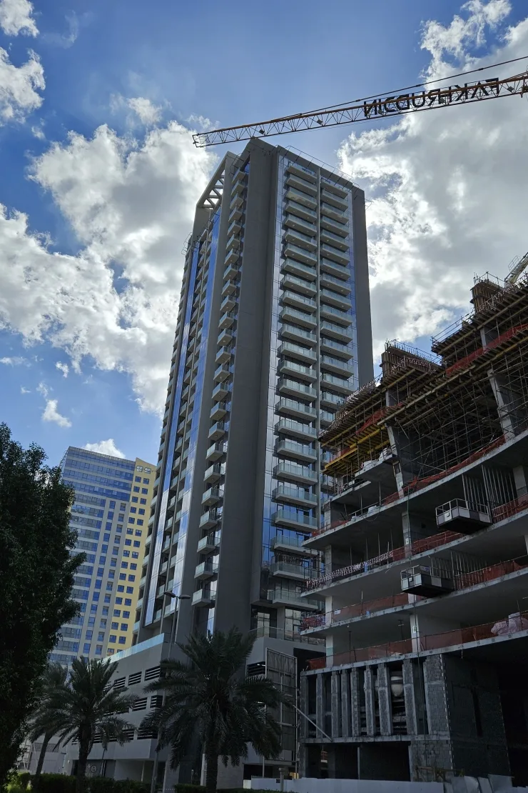Tower with balconies seen from below, blue sky