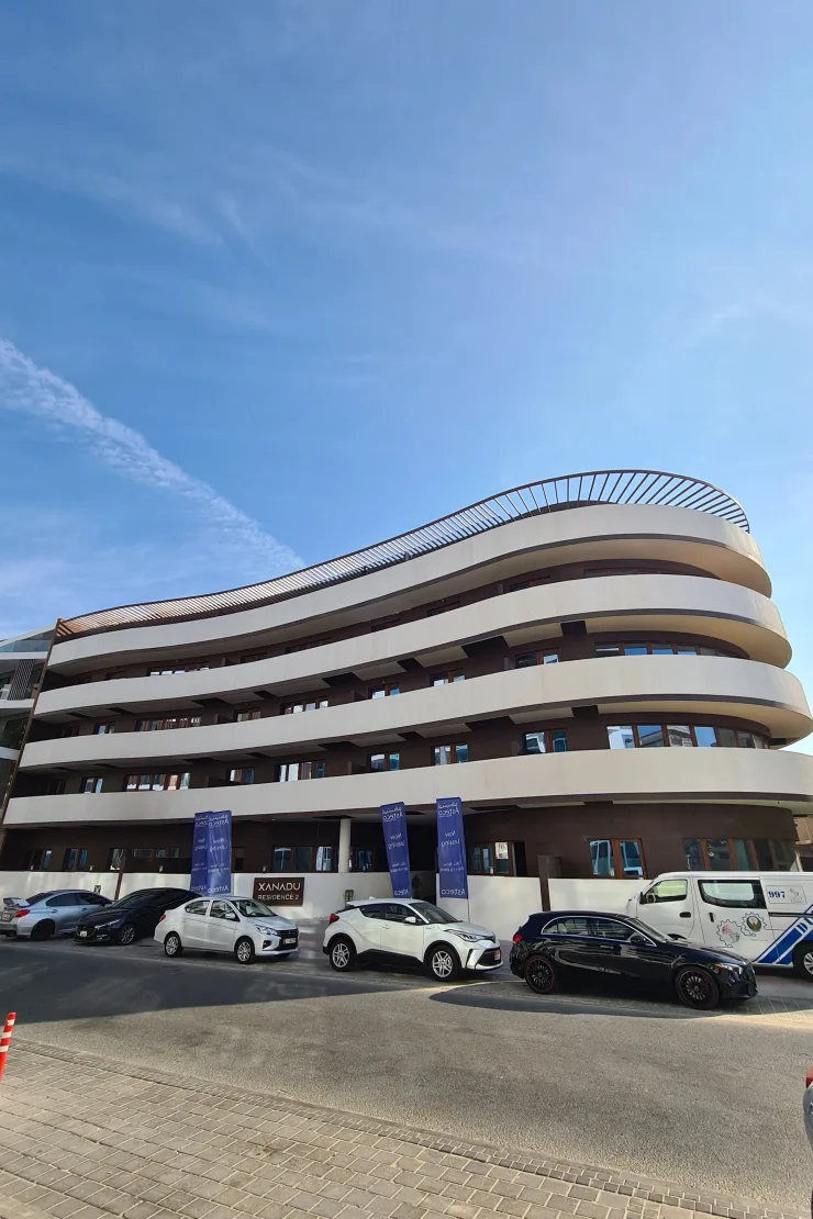 Completed curved facade with Xanadu Residence 2 signage