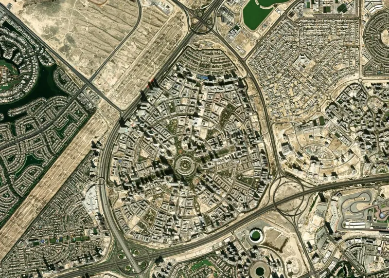 Satellite view of the whole of JVC, a round community of streets in rings and spokes between Al Khail Road and Sheikh Mohammed Bin Zayed Road